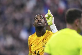 Mike Maignan décisif dans la séance des tirs au but. KEYSTONE/AP/Thibault Camus
